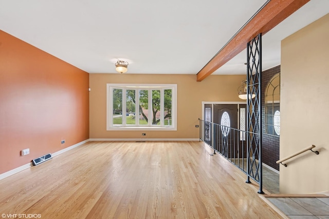 1826 Coolidge Ave, Berkeley, IL 60163 - unfurnished living room with wood finished floors, baseboards, and beamed ceiling
