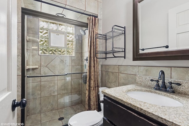 1826 Coolidge Ave, Berkeley, IL 60163 - full bath with a stall shower, tile walls, vanity, and toilet