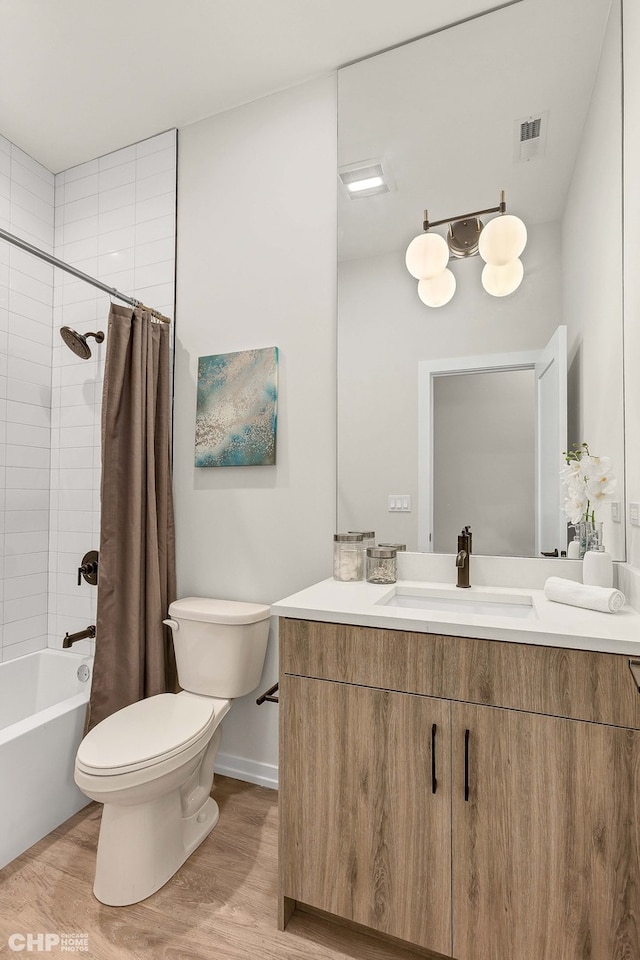 5201 S Wabash Ave, Chicago, IL 60615 - bathroom with wood finished floors, toilet, vanity, and shower / bathtub combination with curtain