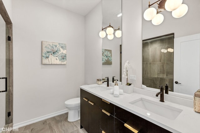 5201 S Wabash Ave, Chicago, IL 60615 - bathroom featuring tiled shower, toilet, double vanity, and baseboards