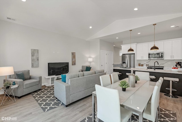 5201 S Wabash Ave, Chicago, IL 60615 - dining area with light wood finished floors, lofted ceiling, and recessed lighting