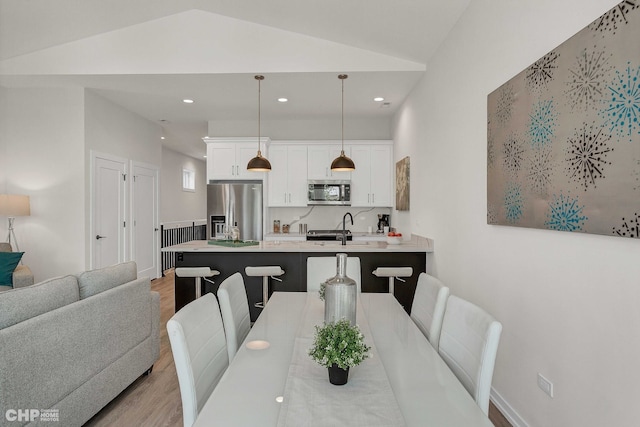 5201 S Wabash Ave, Chicago, IL 60615 - dining space featuring wood finished floors, vaulted ceiling, and recessed lighting