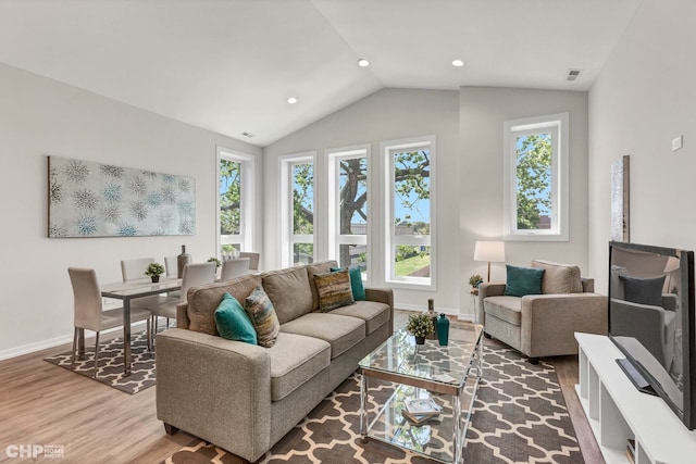 5201 S Wabash Ave, Chicago, IL 60615 - living area with wood finished floors, baseboards, vaulted ceiling, and recessed lighting