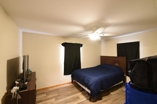 8848 Meade Ave, Oak Lawn, IL 60453 - bedroom featuring light wood-type flooring, a ceiling fan, and baseboards