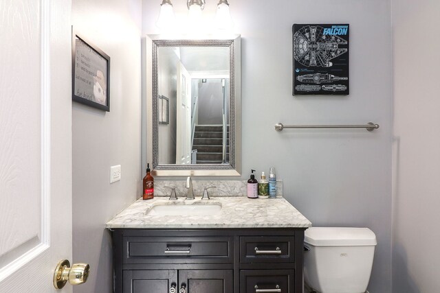 bathroom with toilet and vanity