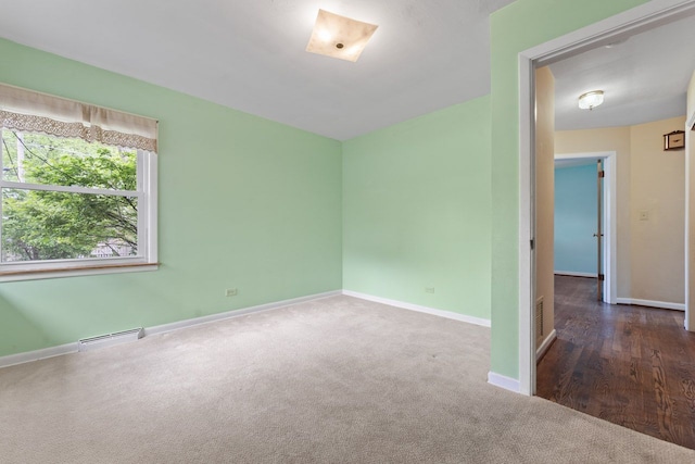 202 N Elmhurst Ave, Mount Prospect, IL 60056 - carpeted empty room featuring baseboards and baseboard heating