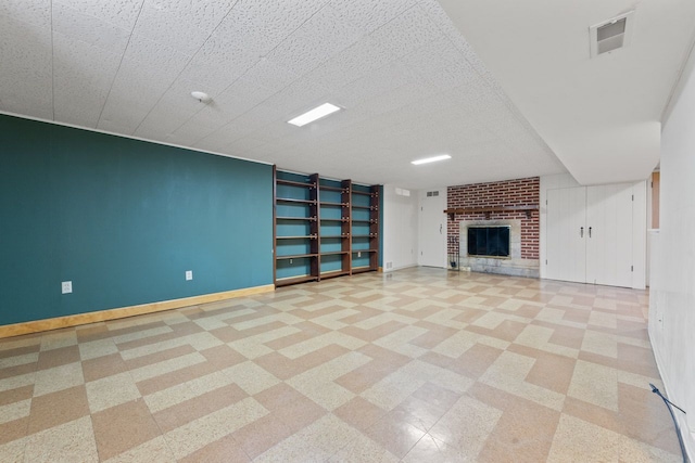 202 N Elmhurst Ave, Mount Prospect, IL 60056 - unfurnished living room featuring baseboards, a fireplace, tile patterned floors, and built in features