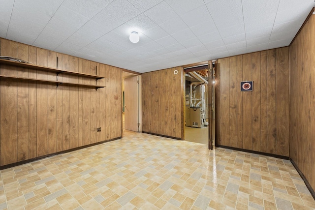 202 N Elmhurst Ave, Mount Prospect, IL 60056 - finished basement with wood walls, heating unit, and baseboards