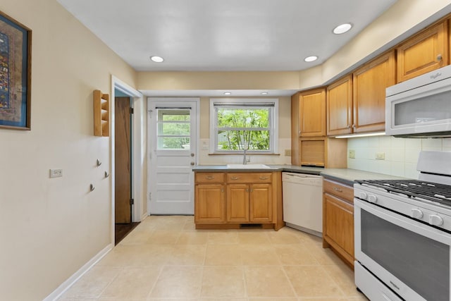 202 N Elmhurst Ave, Mount Prospect, IL 60056 - kitchen featuring white appliances, backsplash, a sink, brown cabinetry, and recessed lighting