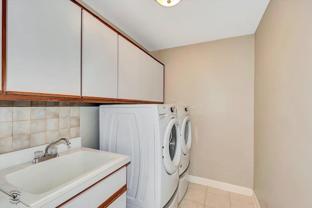 16313 Bob White Cir, Orland Park, IL 60467 - laundry area featuring cabinet space, washer and dryer, light tile patterned flooring, and baseboards