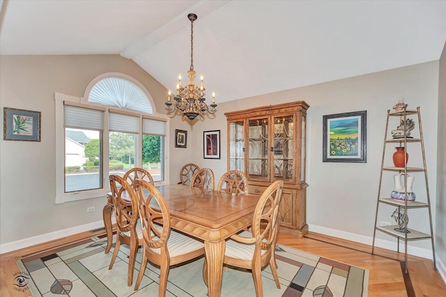 16313 Bob White Cir, Orland Park, IL 60467 - dining area with a chandelier, plenty of natural light, light wood-style flooring, baseboards, and high vaulted ceiling