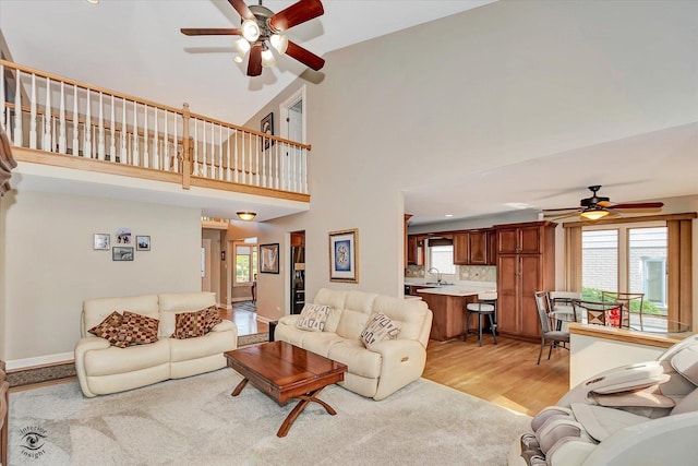 16313 Bob White Cir, Orland Park, IL 60467 - living area featuring a ceiling fan, light wood-style floors, high vaulted ceiling, and baseboards
