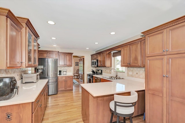 16313 Bob White Cir, Orland Park, IL 60467 - kitchen featuring appliances with stainless steel finishes, a sink, light wood-style floors, recessed lighting, and backsplash