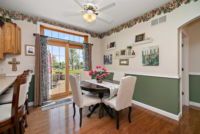 689 Revere St, Bourbonnais, IL 60914 - dining space with wood finished floors, arched walkways, a ceiling fan, and baseboards