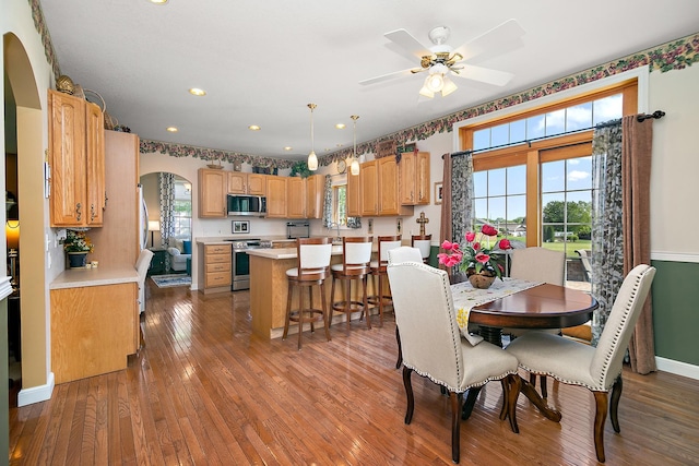 689 Revere St, Bourbonnais, IL 60914 - dining space featuring arched walkways, hardwood / wood-style floors, ceiling fan, baseboards, and recessed lighting