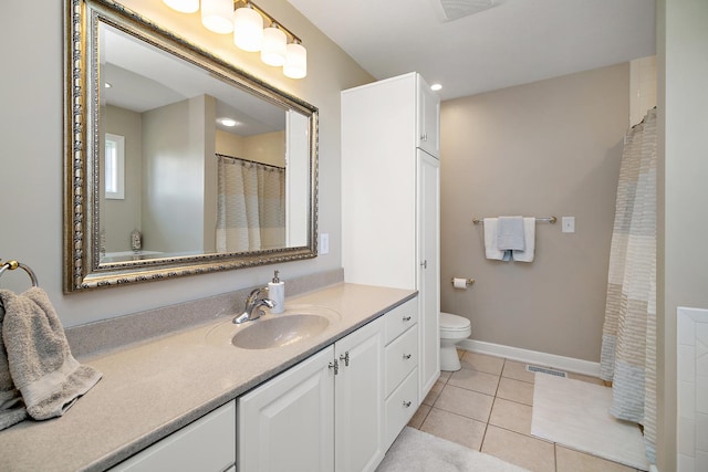 689 Revere St, Bourbonnais, IL 60914 - full bathroom with vanity, tile patterned flooring, toilet, and baseboards