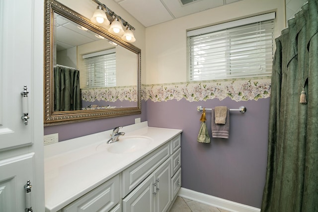 689 Revere St, Bourbonnais, IL 60914 - bathroom featuring vanity, tile patterned flooring, and baseboards
