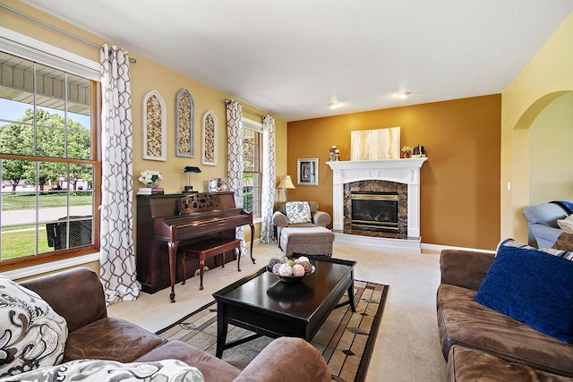 689 Revere St, Bourbonnais, IL 60914 - carpeted living room featuring arched walkways and a fireplace