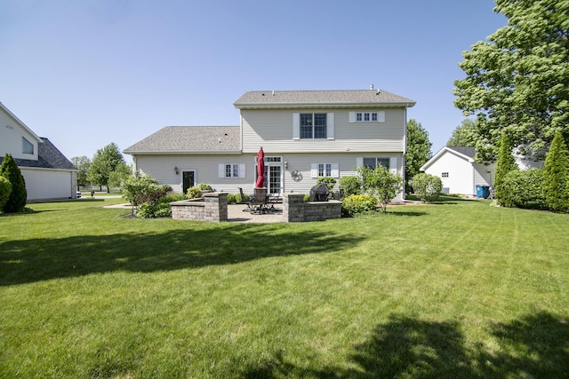 689 Revere St, Bourbonnais, IL 60914 - rear view of property with a patio and a yard