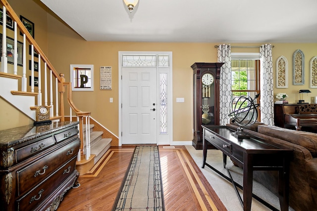 689 Revere St, Bourbonnais, IL 60914 - foyer featuring light wood-style floors, stairs, and baseboards