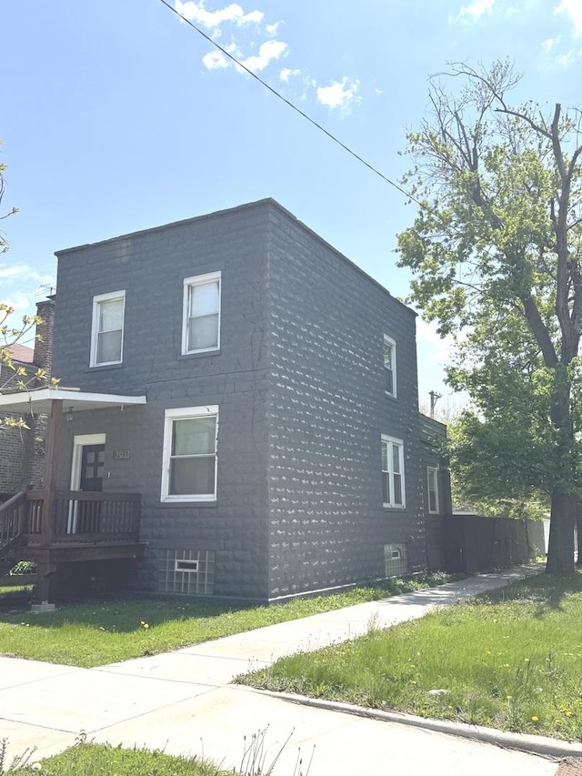 701 E 89th Pl, Chicago, IL 60619 - view of home's exterior with a lawn