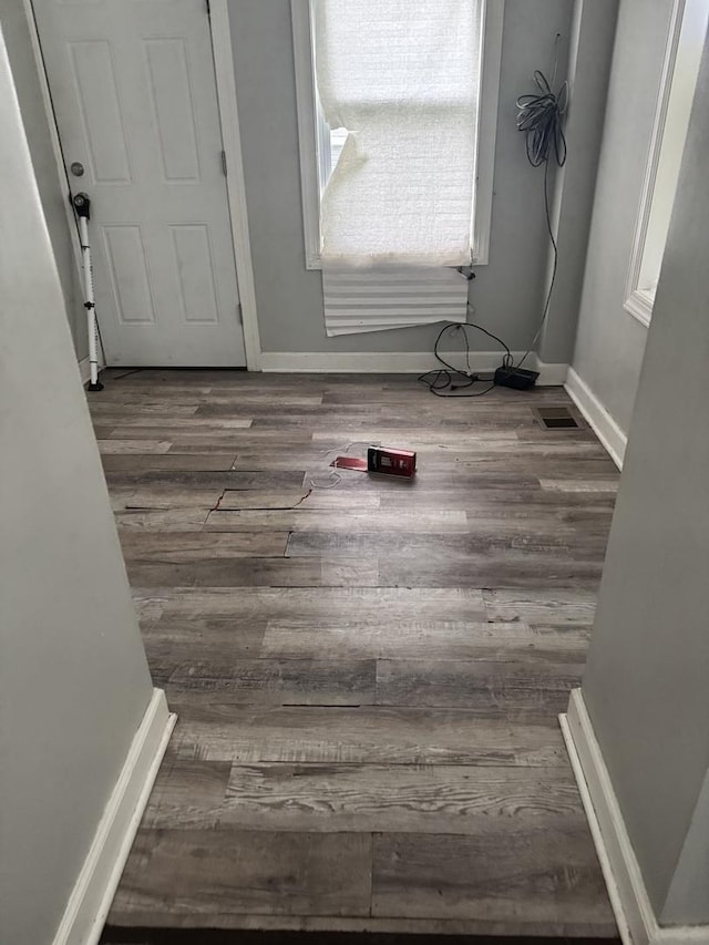 701 E 89th Pl, Chicago, IL 60619 - laundry area with wood finished floors and baseboards