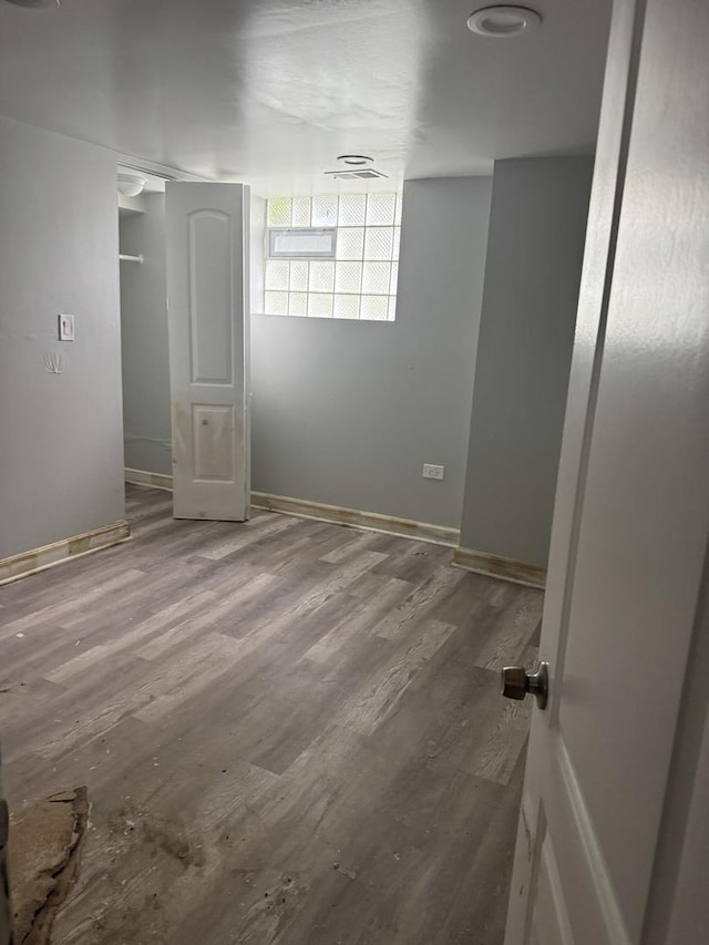 701 E 89th Pl, Chicago, IL 60619 - unfurnished bedroom featuring wood finished floors and baseboards