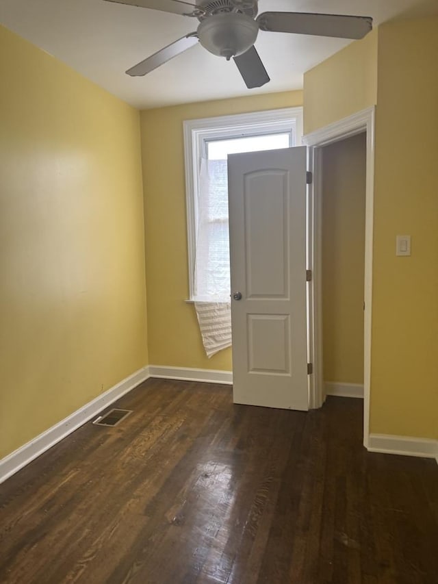 701 E 89th Pl, Chicago, IL 60619 - entrance foyer with baseboards, a ceiling fan, and dark wood-type flooring