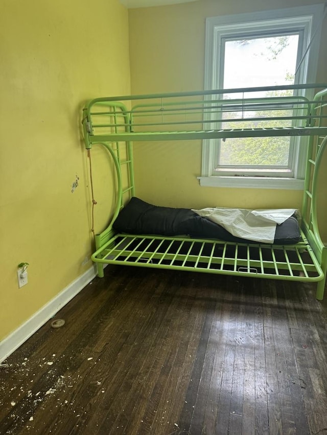 701 E 89th Pl, Chicago, IL 60619 - unfurnished bedroom with wood-type flooring and baseboards