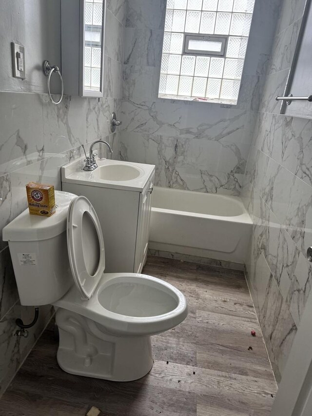 701 E 89th Pl, Chicago, IL 60619 - full bath featuring wood finished floors, toilet, and vanity