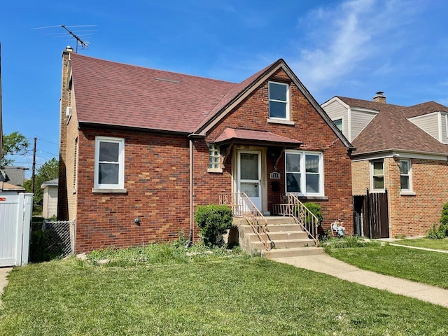 7304 W 57th St, Summit, IL 60501 - view of front of house with a shingled roof and brick siding