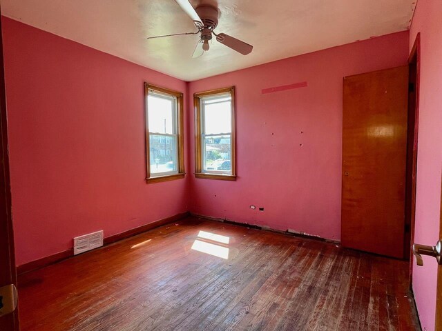 7304 W 57th St, Summit, IL 60501 - spare room with wood finished floors and ceiling fan
