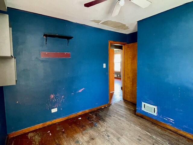 7304 W 57th St, Summit, IL 60501 - unfurnished room with a ceiling fan, wood finished floors, and baseboards