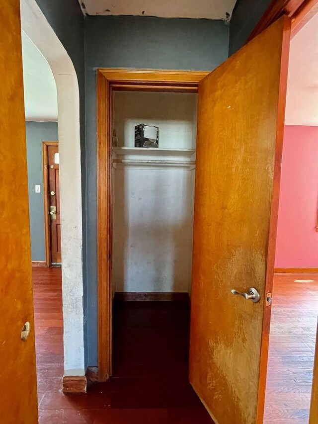 7304 W 57th St, Summit, IL 60501 - hallway featuring wood finished floors and arched walkways