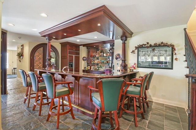 64 Ridge Rd, Barrington Hills, IL 60010 - indoor dry bar featuring paneled built in fridge, baseboards, recessed lighting, and dark stone finish floors