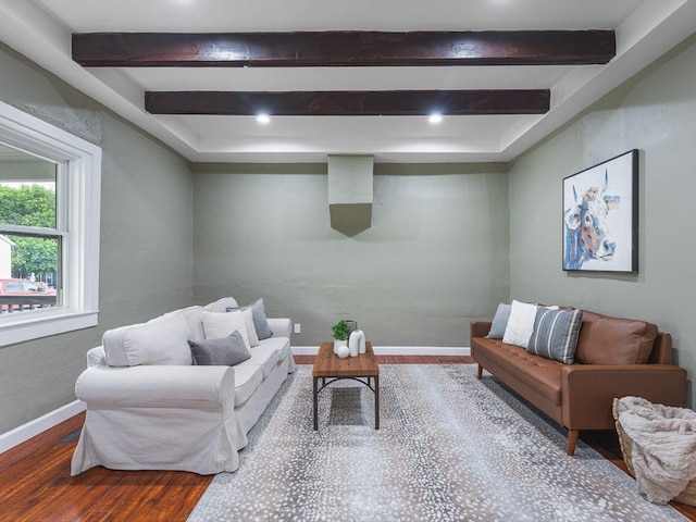 426 Reed St, Pecatonica, IL 61063 - living area featuring wood finished floors, beam ceiling, and baseboards