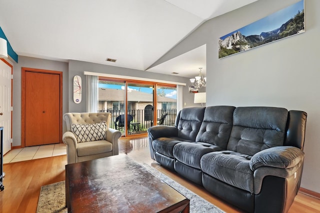 10248 SW Hwy Unit 3C, Chicago Ridge, IL 60415 - living area featuring a chandelier, vaulted ceiling, and light wood-style floors