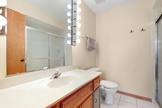 10248 SW Hwy Unit 3C, Chicago Ridge, IL 60415 - full bathroom featuring a shower stall, toilet, vanity, tile patterned flooring, and baseboards