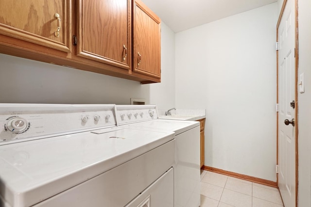 10248 SW Hwy Unit 3C, Chicago Ridge, IL 60415 - laundry area featuring separate washer and dryer, cabinet space, baseboards, and light tile patterned floors