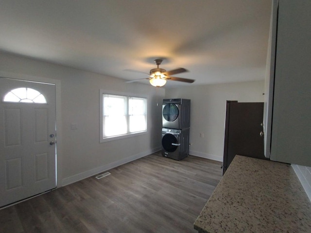 615 Hamrick Ave, Romeoville, IL 60446 - entrance foyer with estacked washer and dryer, ceiling fan, wood finished floors, and baseboards