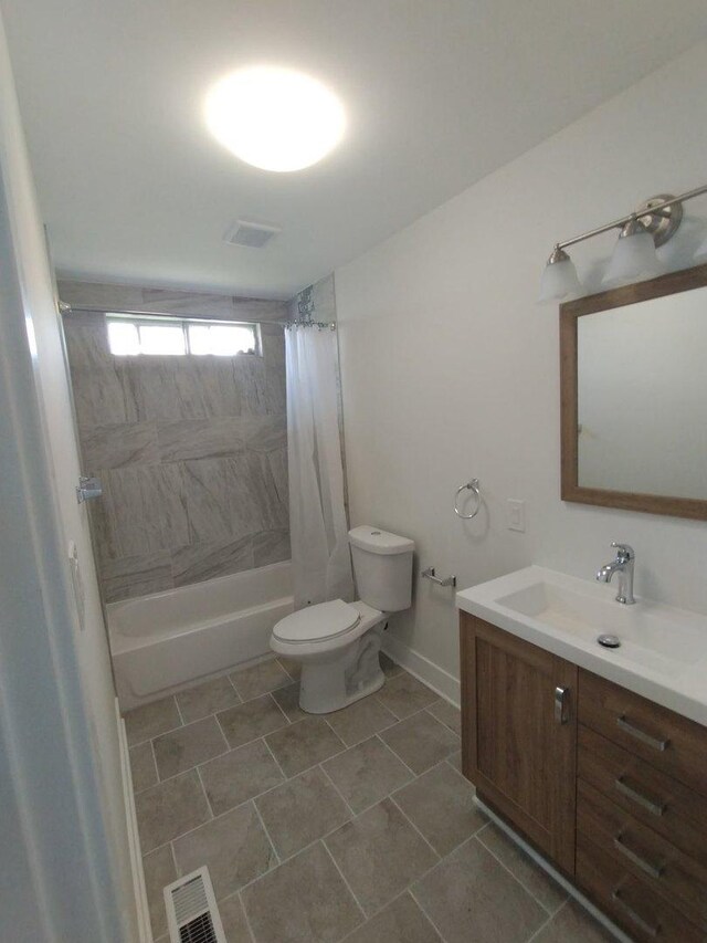 615 Hamrick Ave, Romeoville, IL 60446 - bathroom featuring shower / bathtub combination with curtain, toilet, vanity, tile patterned flooring, and baseboards