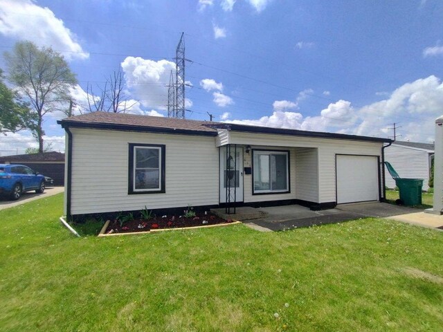 615 Hamrick Ave, Romeoville, IL 60446 - single story home with a garage, a front yard, and concrete driveway