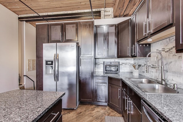 2654 W Medill Ave Unit 202, Chicago, IL 60647 - kitchen with stainless steel appliances, a sink, wood ceiling, and dark brown cabinets