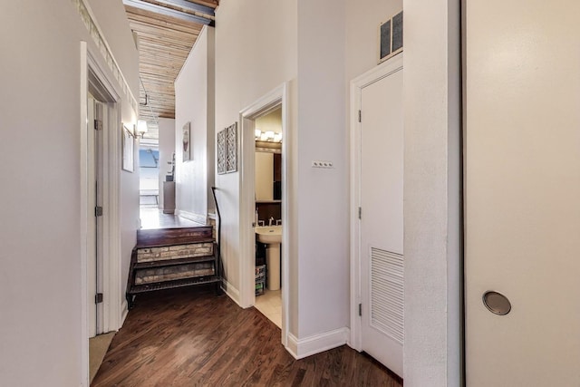 2654 W Medill Ave Unit 202, Chicago, IL 60647 - corridor featuring dark wood-style flooring and baseboards