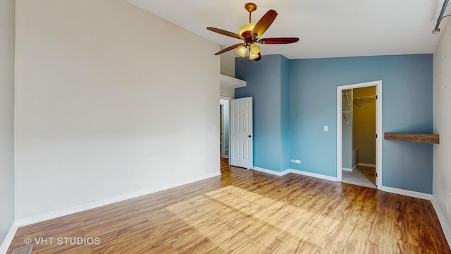 733 Fieldcrest Dr Unit A, South Elgin, IL 60177 - spare room with wood finished floors, ceiling fan, and baseboards