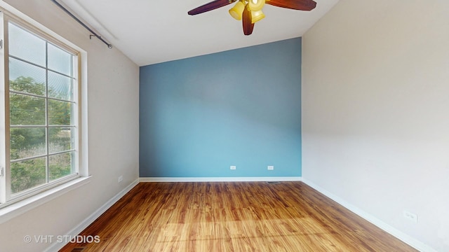 733 Fieldcrest Dr Unit A, South Elgin, IL 60177 - empty room featuring wood finished floors, a ceiling fan, and baseboards