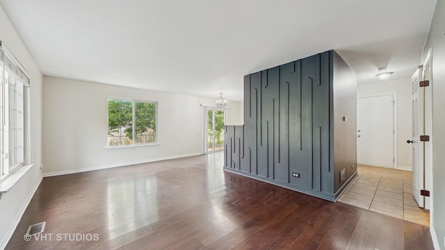 733 Fieldcrest Dr Unit A, South Elgin, IL 60177 - unfurnished room featuring wood finished floors, a chandelier, and baseboards