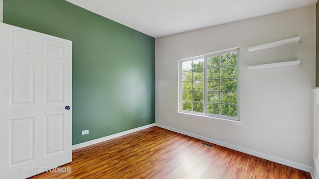 733 Fieldcrest Dr Unit A, South Elgin, IL 60177 - spare room with baseboards and wood finished floors
