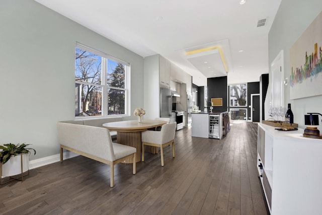 3056 N Monticello Ave, Chicago, IL 60618 - dining room with dark wood finished floors, baseboards, and beverage cooler