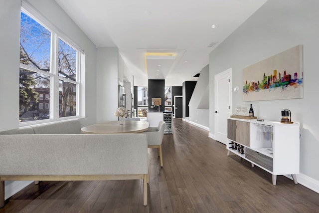 3056 N Monticello Ave, Chicago, IL 60618 - living room with dark wood-style floors, wine cooler, and baseboards